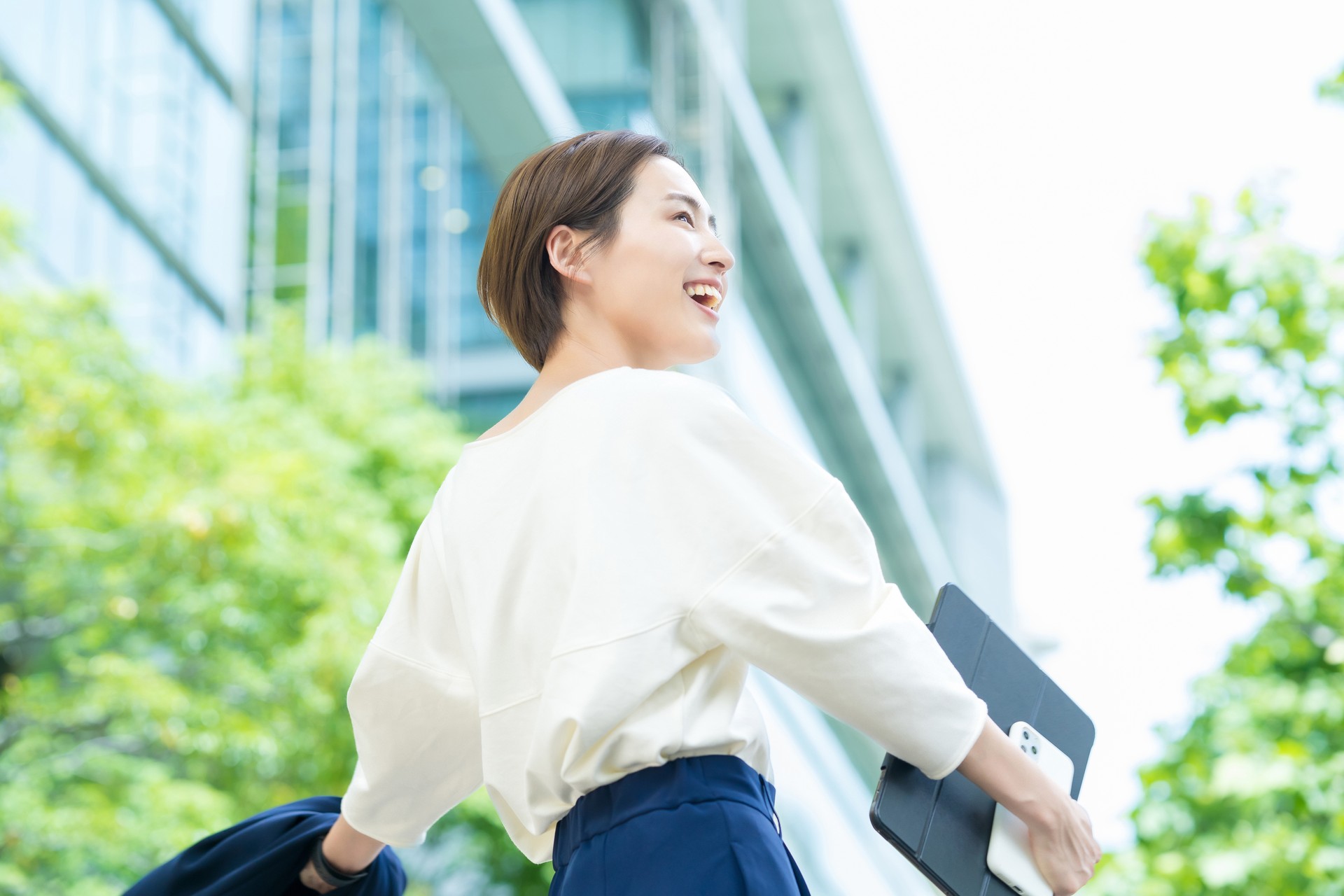 Woman looking up at the sky (business woman)
